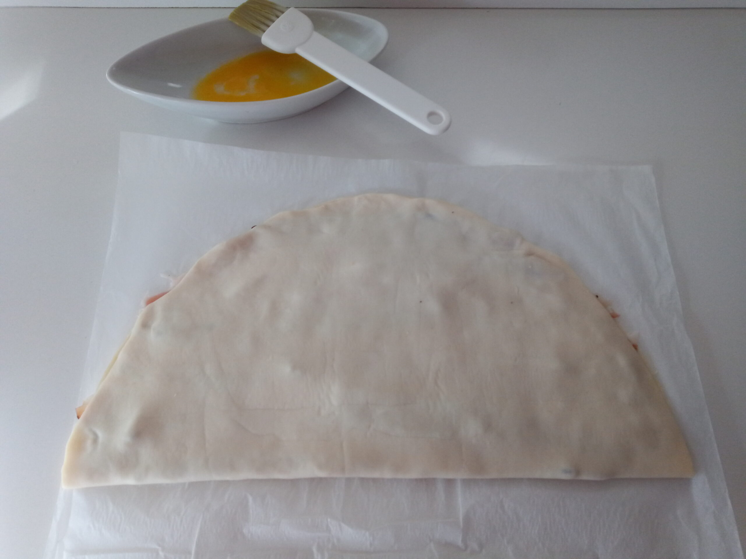 Treccine di sfoglia e speck